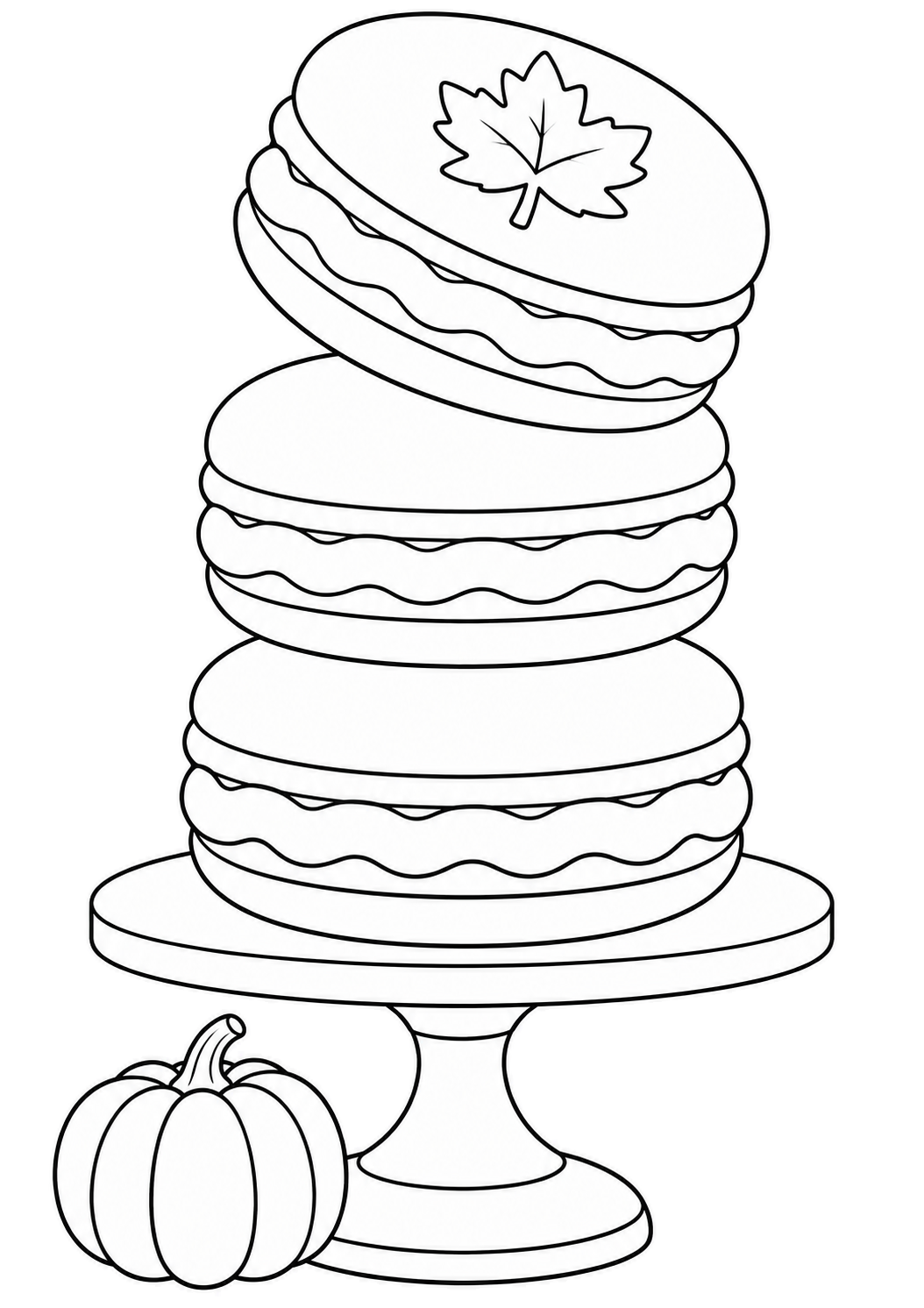 Tre macaron impilati su un'alzata, con una foglia sul guscio superiore e una zucca vicino alla base.